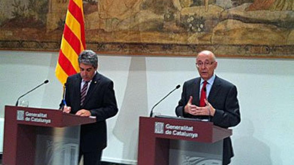 El consejero de la Presidencia y portavoz de la Generalitat, Francesc Homs, y el expresidente del Parlament Joan Rigol