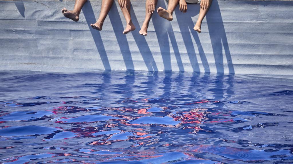 Varios de los migrantes que viajan en una patera avistada por la ONG Open Arms desde el barco 'Astral', a 8 de septiembre de 2021, en el Mar Mediterráneo