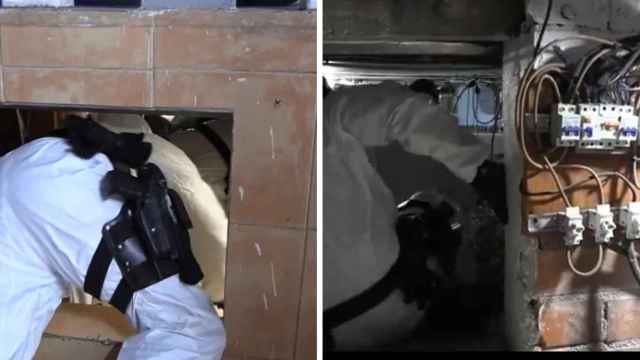 Agente de los Mossos accediendo a gatas a un bunker de marihuana descubierto en El Prat de Llobregat (BCN)