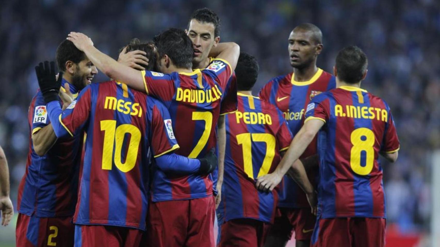 Los jugadores del Barça celebran uno de sus cinco goles al Espanyol en diciembre de 2010