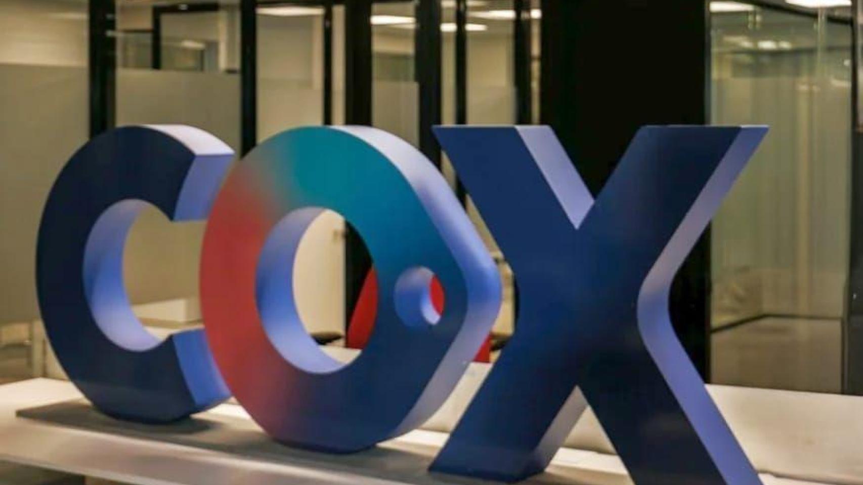 Logotipo de Cox