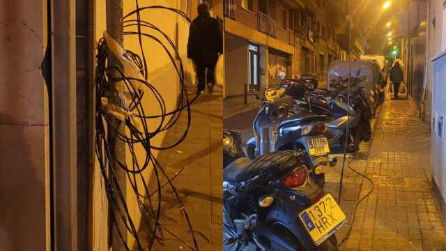 Las luces de Navidad en El Carmel colgando de farolas y motos de la acera