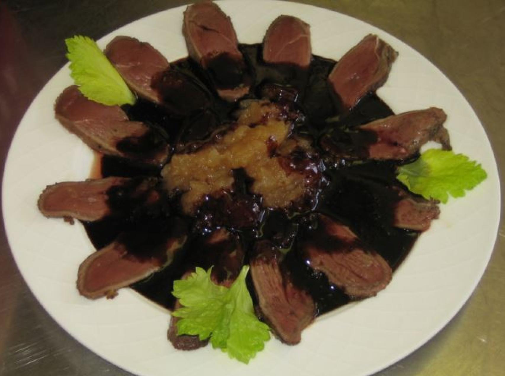 Magret con salsa de arándanos