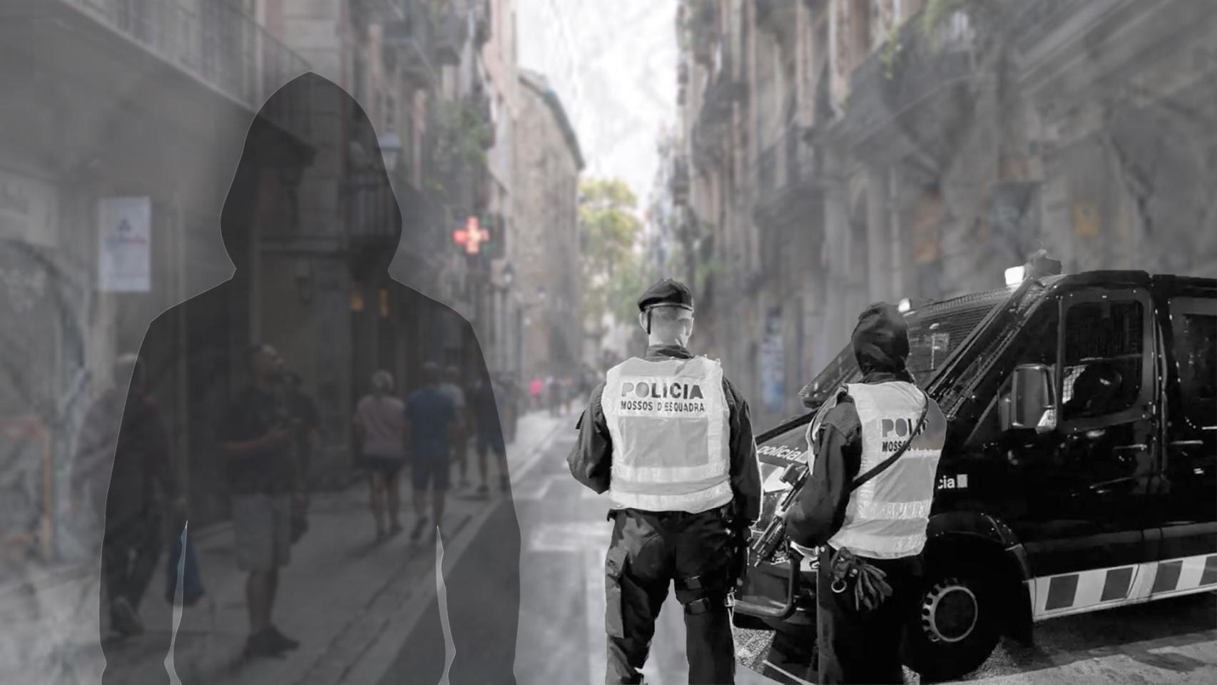 Agentes de los Mossos d'Esquadra con una calle del Raval de fondo
